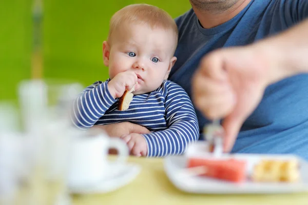 Baby boy having piece of bread — Stock Photo, Image