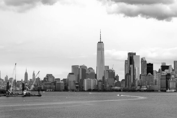 Black and white photo of famous New York City panorama with skyscrapers of Manhattan on the background. Travel, tourism, sightseeing of New York city, USA.
