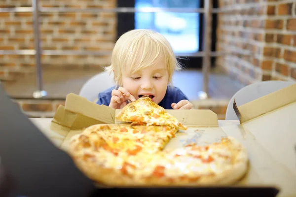 Cute Blonde Boy Eating Slice Pizza Fast Food Restaurant Hungry — Fotografia de Stock