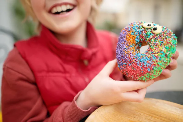 Little Child Eating Funny Colorful Donut Street Cafe While Walking — Foto de Stock