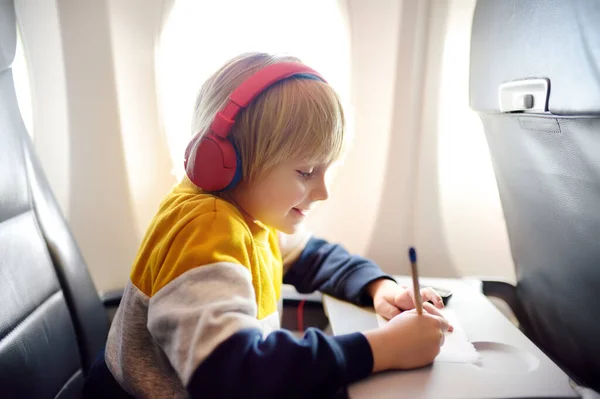 Cute Little Boy Traveling Airplane Child Using Player Listen Music — Foto de Stock