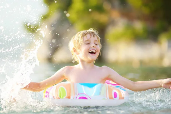 Little Boy Swimming Colorful Floating Ring Sea Sunny Summer Day — Foto Stock