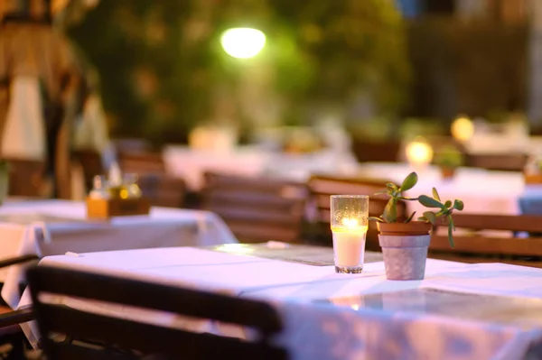 Empty Outdoor European Cafe Dusk Stylish Table Decoration Borning Candle — Stock Photo, Image