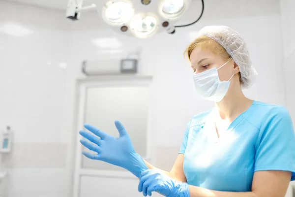 Female Surgeon Puts Medical Protective Gloves Doctor Preparing Surgery Operation — 图库照片