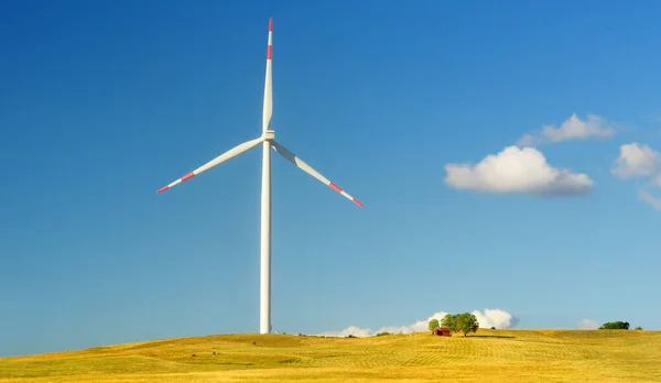 Power station for renewable electric energy production. Windmill on sunny summer day. High wind turbine for generation electricity. Green energy concept.