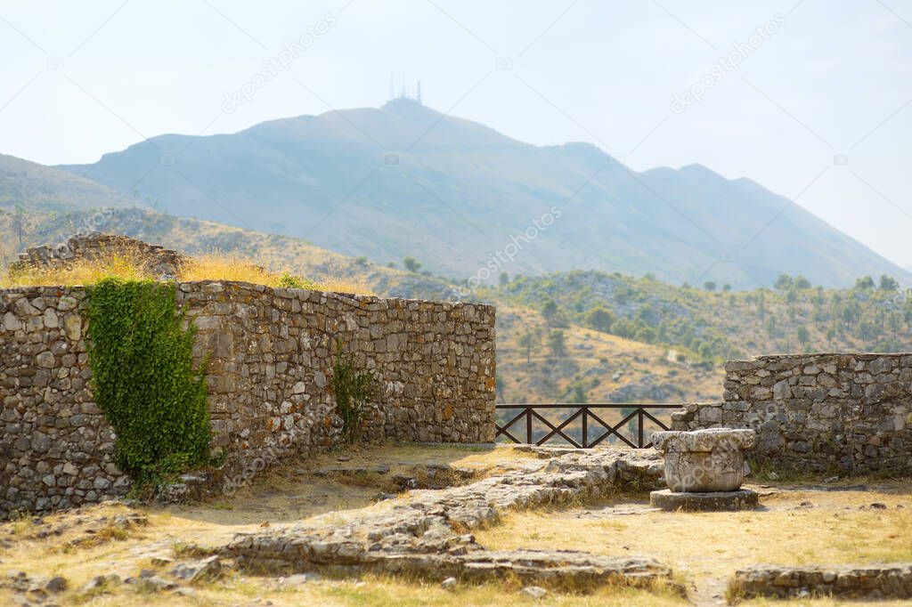 View of Fortress Rozafa near Shkodra city in amazing valley among mountains in Albania. Ancient stone walls and towers of fort attracts visitors from all over the world. Travel and tourism in Balkan