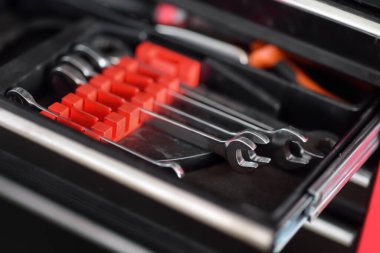 Repair tools in car service shop or garage. Diagnostics, warranty maintenance and repair of vehicle. Professional equipments and devices for auto mechanic.