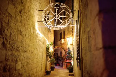 Christmas illumination and decoration on streets of Kotor old town. Christmas Eve in Montenegro. Xmas vacations in Montenegro. Winter holidays in Europe.