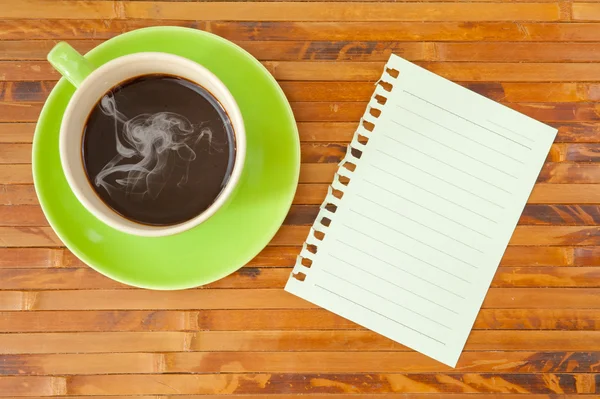 Green cup and note paper