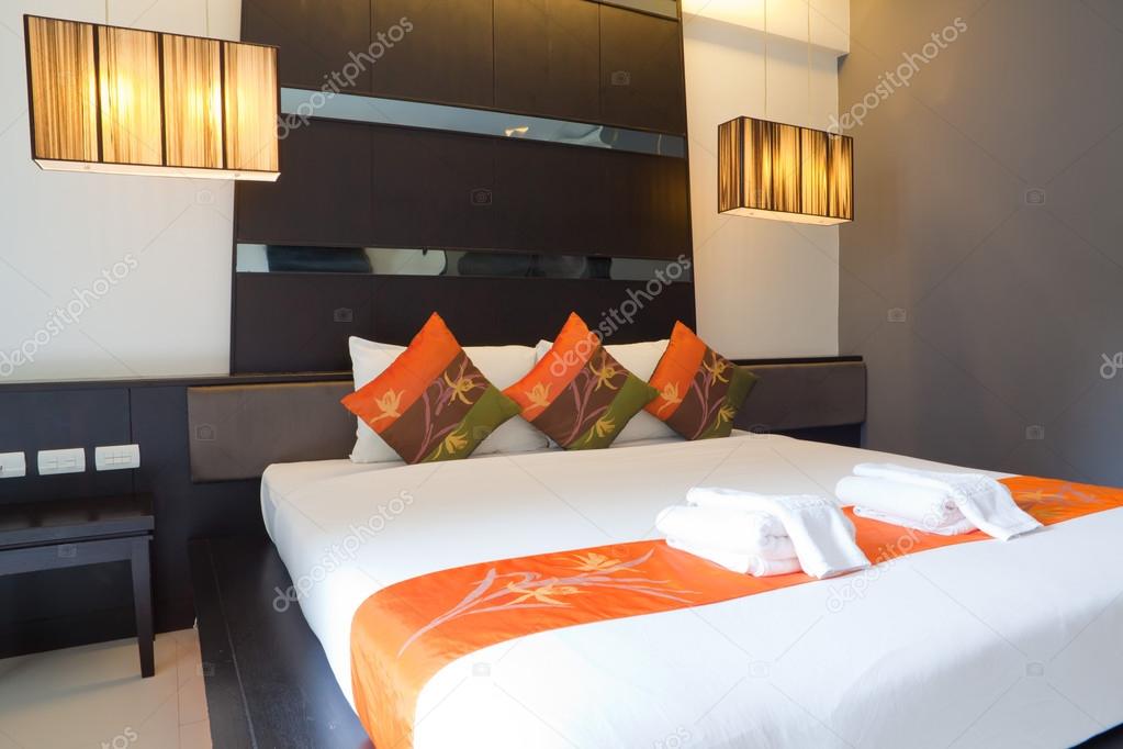 Hotel room with bed and wooden