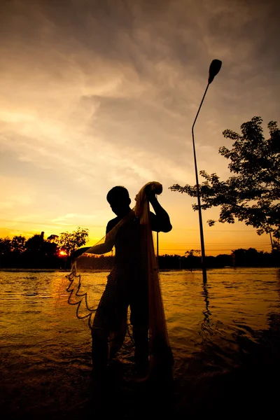 Silhouette of fishermen — Stock Photo, Image