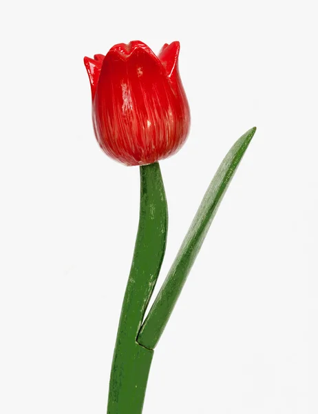 Red plastic tulip flower — Stock Photo, Image