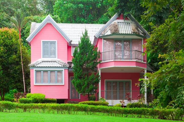 Pink house in forest — Stock Photo, Image