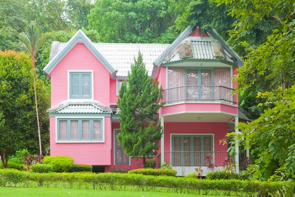 Pink house in forest — Stock Photo, Image