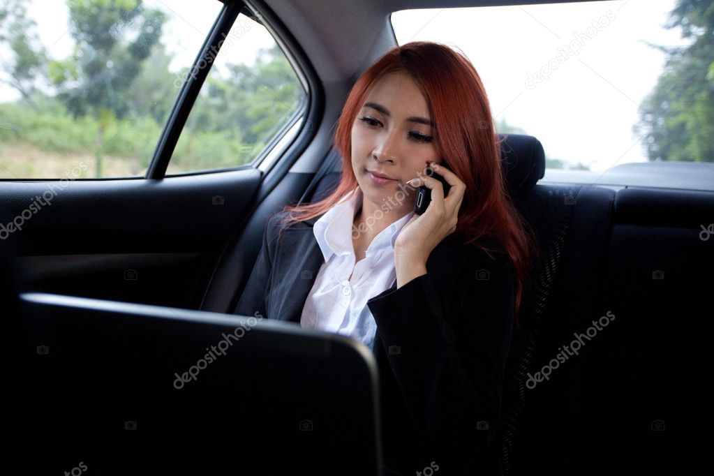 woman using laptop and mobile phone