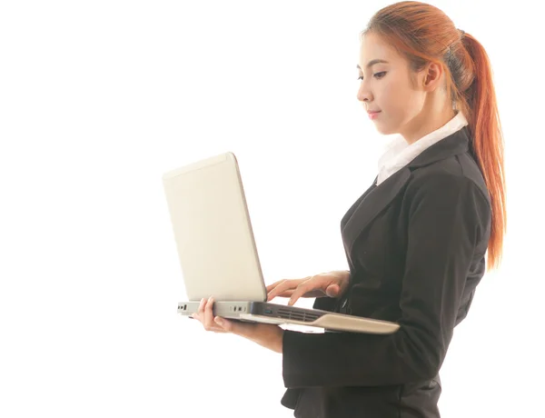 Business woman standing using laptop — Stock Photo, Image