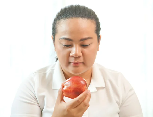 Tlustá žena s apple — Stock fotografie