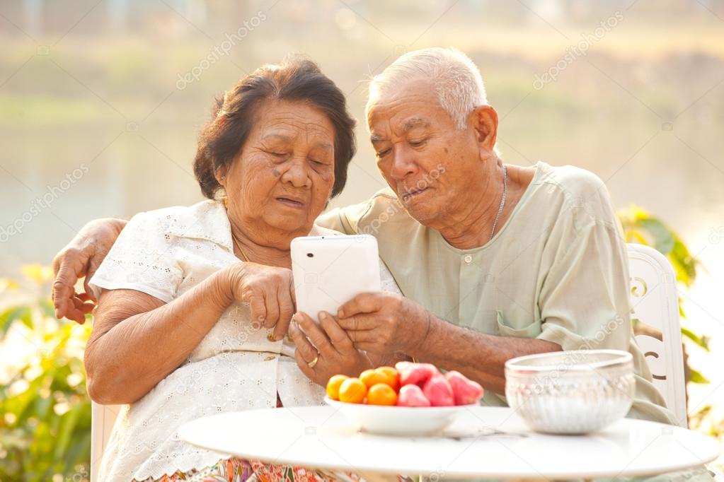 Senior couple using the tablet