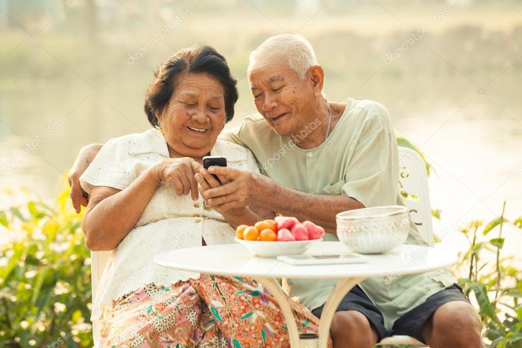 Senior couple using the mobile phone