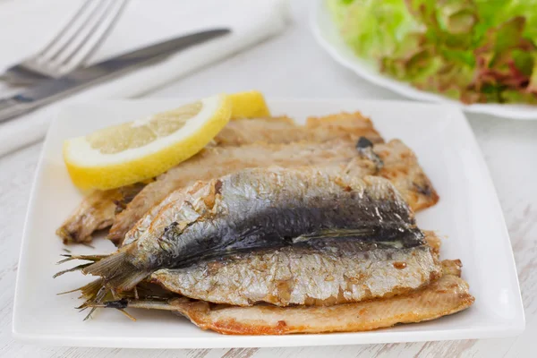 Fried fillet of sardines with lemon — Stock Photo, Image