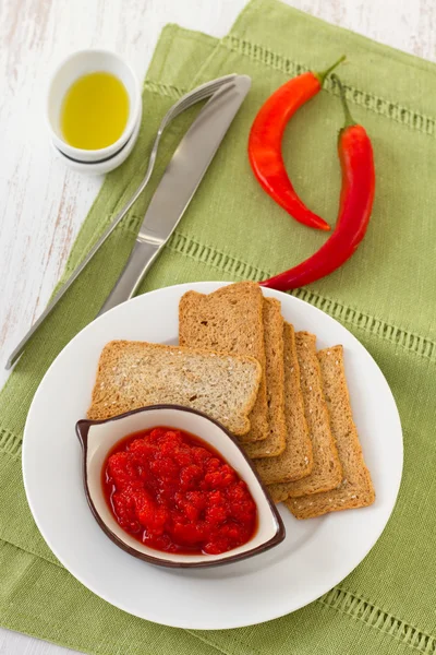 Pepper sauce with toasts — Stock Photo, Image