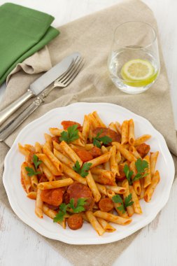 Penne with chorizo and sauce clipart