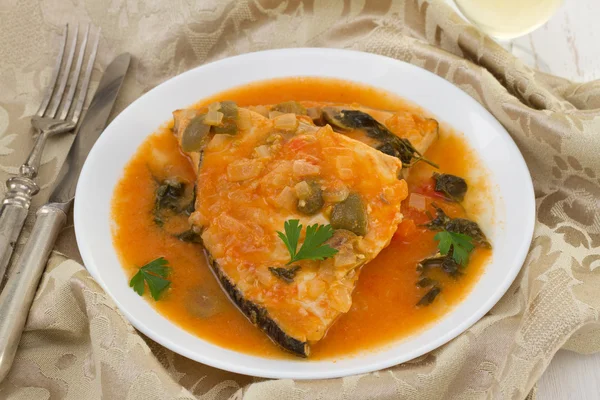 Fish in sauce on the plate — Stock Photo, Image