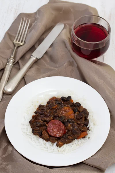 Black beans with chorizo and boiled rice — Stock Photo, Image