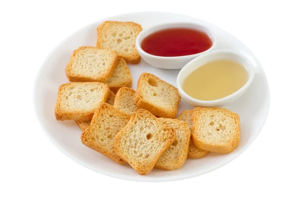 Pane tostato con miele e marmellata sul piatto — Foto Stock