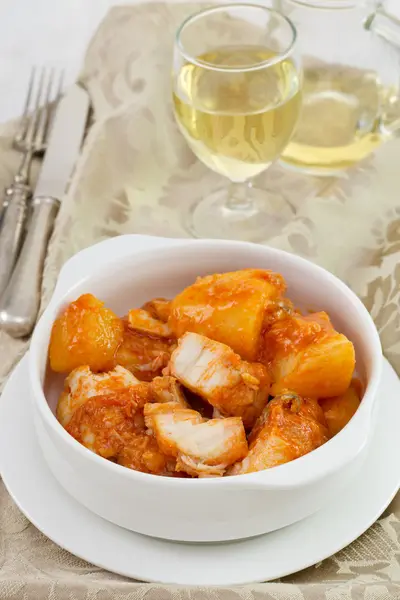 Fish stew in the white bowl with wine — Stock Photo, Image