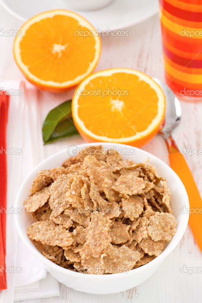 Cereals in the bowl with orange and orange juice — Stock Photo