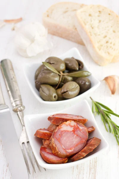 Olives with chourico, rosemary and garlic — Stock Photo, Image