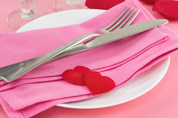 Fork and knife on pink napkin — Stock Photo, Image