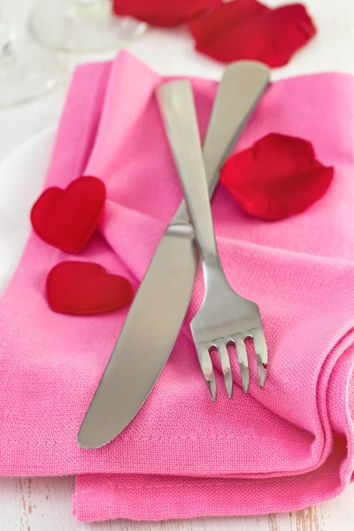 Fork and knife on pink napkin — Stock Photo, Image