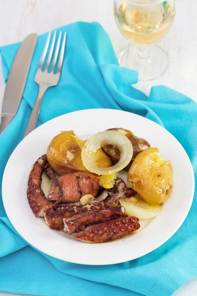 Octopus with potato and oil on the plate — Stock Photo, Image