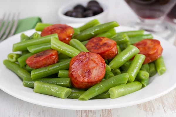 Beans with chorizo on the plate — Stock Photo, Image