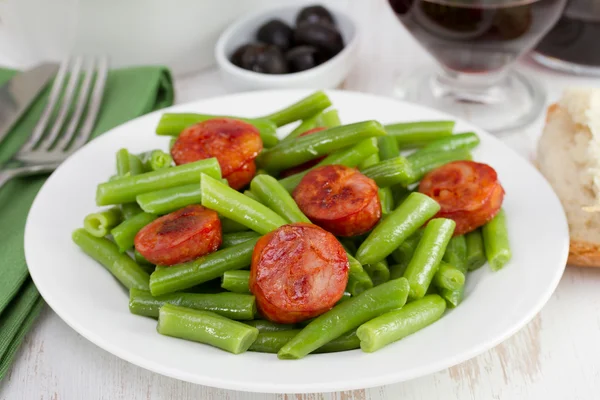 Beans with chorizo on the plate — Stock Photo, Image