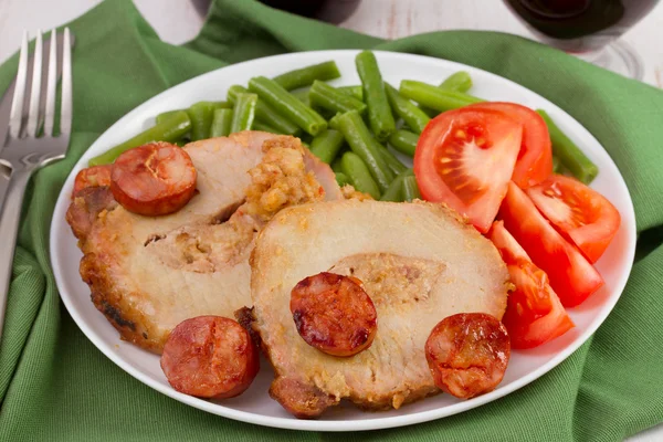 Pork with chorizo on the white plate — Stock Photo, Image