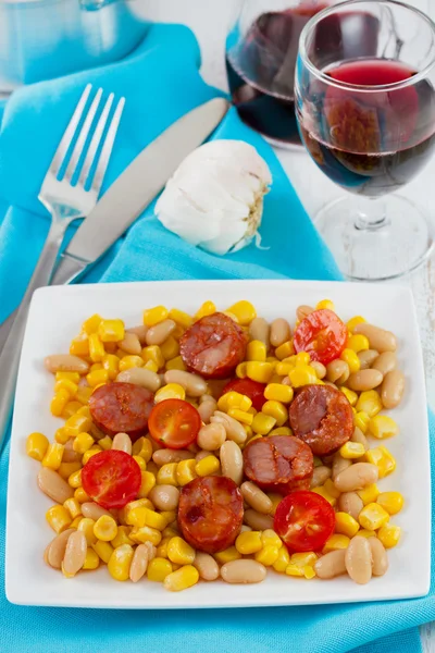 Fried sausages with corn and beans on the plate — Stock Photo, Image