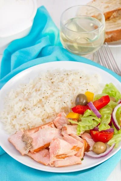 Fish with rice and salad on the white plate — Stock Photo, Image