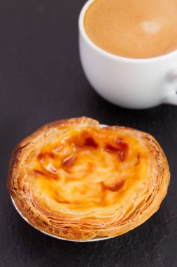 Pastel de nata with cup of coffee