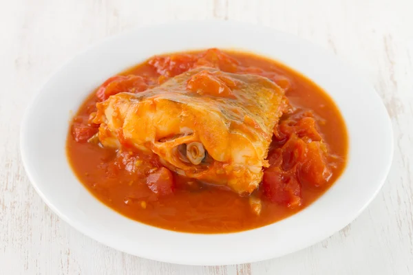 Fish in sauce in white bowl — Stock Photo, Image