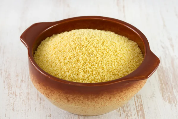 Couscous in brown bowl in white table — Stock Photo, Image