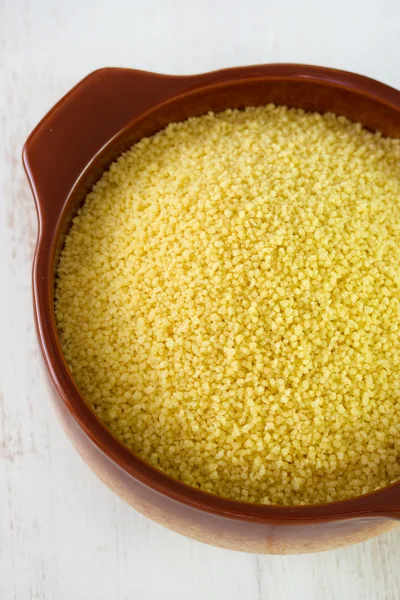 Couscous in brown bowl — Stock Photo, Image