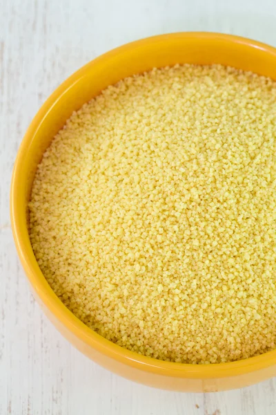 Couscous in yellow dish — Stock Photo, Image