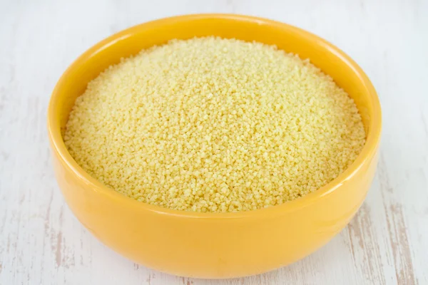 Couscous in yellow bowl — Stock Photo, Image