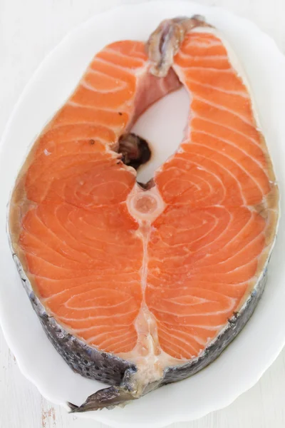 Raw salmon on dish — Stock Photo, Image