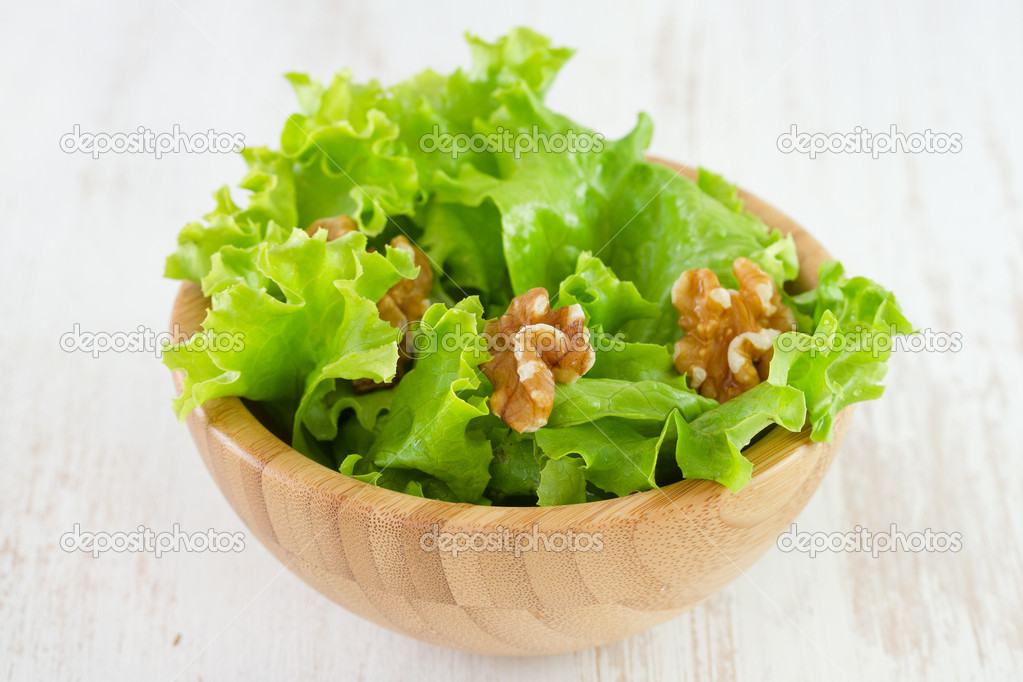 Salad with walnut in bowl
