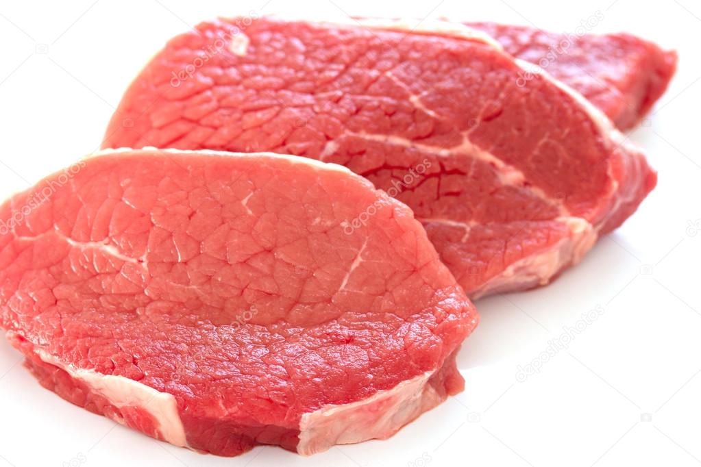 Raw beef on white background