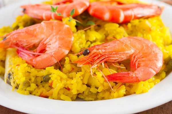 Shrimps with yellow rice — Stock Photo, Image